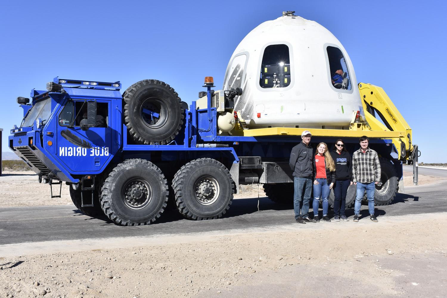 Carthage's MPG-TRIO experiment team in front of the New Shepard capsule after the NS-10 mission landing and recovery.